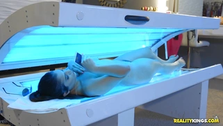 Violet Starr masturbates in the tanning bed while taking selfies