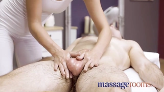 Sexy, saucy young masseuse Katie Rose gives an oily handjob