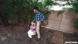 Violet Gems is sucking black cock outdoors