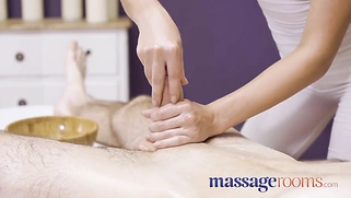 Sexy, saucy young masseuse Katie Rose gives an oily handjob