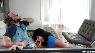 Adria Rae is sucking Brick Danger's cock as he playing video games