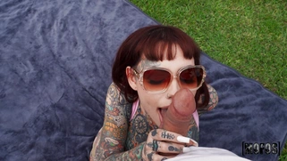 Tiger Lilly wearing sunglasses is sucking big cock outdoors