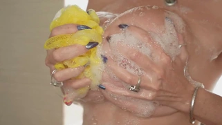 Kat Marie takes the shower and shows off her big boobs