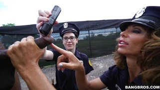 Cock hungry cops Lyla Lali and Norah Gold sucking giant black pole