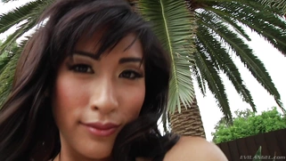 Mia Li's tits and ass poke gorgeously from her lace body stocking