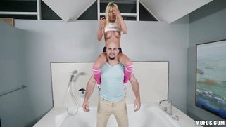 Kenzie Reeves has fun with Jmac in the bathtub