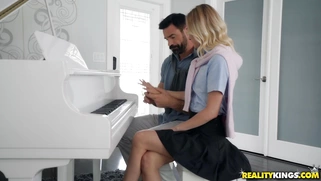 Kenzie Kai takes piano lessons from Charles Dera