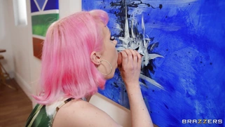 Evie Rees is sucking huge cock through the glory hole
