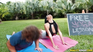 Latina Victoria June does yoga exercises outdoors