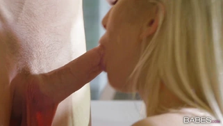 Cayla Lyons on her knees is sucking cock