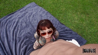 Tiger Lilly wearing sunglasses is sucking big cock outdoors